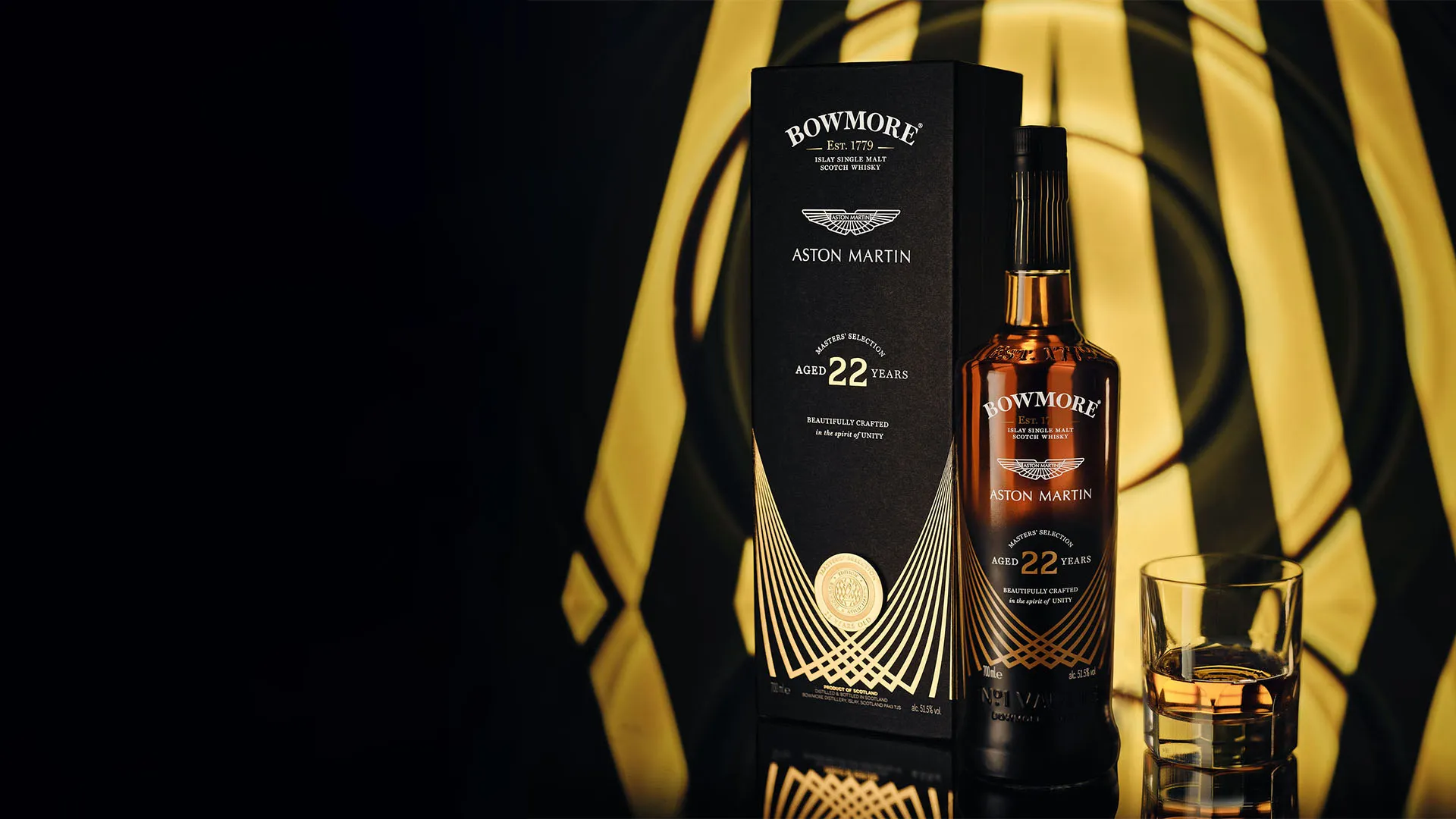 bowmore and aston martin masters reunite for the introduction of masters selection 22 year old single malt scotch whisky